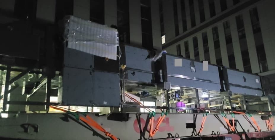 The tunnel-freezer equipment on a flat rack during this shipment’s night-time loading operation.