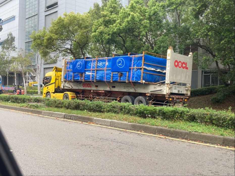 Loaded OOCL flat rack on a truck